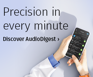 person holding phone with two hands in front of a light grey background