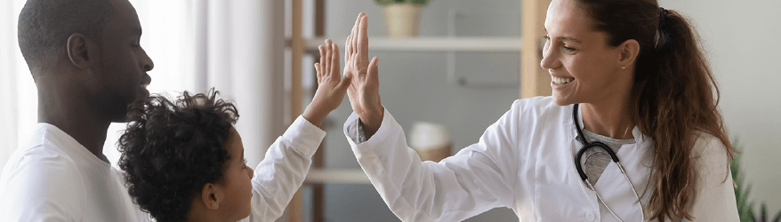 pediatrician-high-fives-patient-with-parent